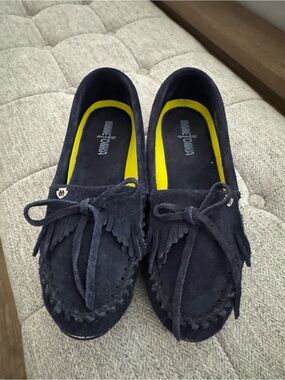NWOT, Minnetonka navy suede moccasins . Women’s size 9